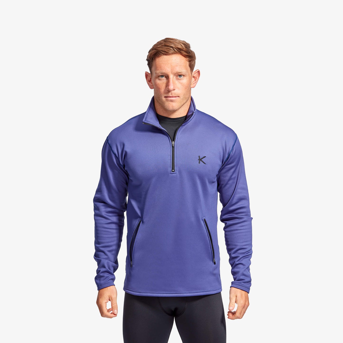 Man wearing Kymira Men’s Infrared Half Zip Fleece — infrared mid-layer with temperature-regulating technology. Blue
