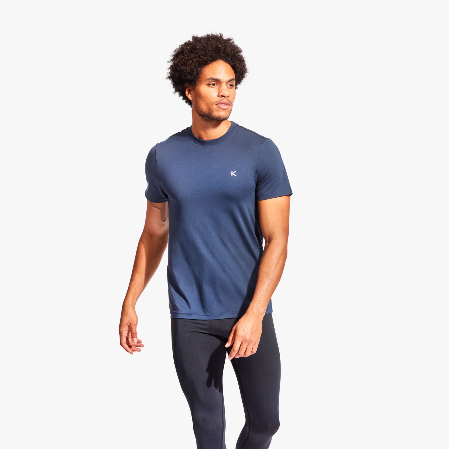 Man wearing Kymira Men's Infrared Recovery T-Shirt, lightweight recovery wear with infrared technology. Blue