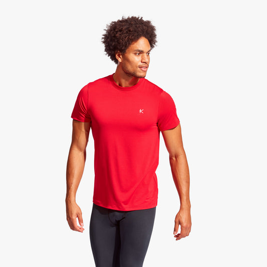 Man wearing Kymira Men's Infrared Recovery T-Shirt, lightweight recovery wear with infrared technology. Red